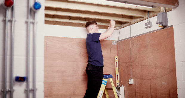 An Electrical Student at Sunderland College, working on installing wires