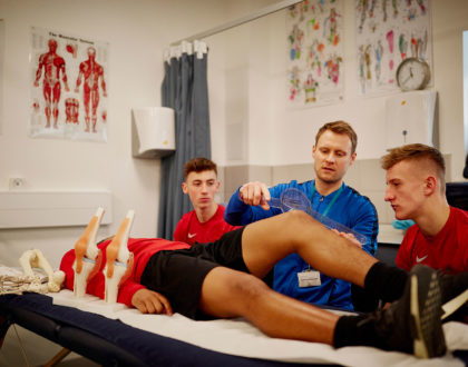 Sport and public services students performing a practical.