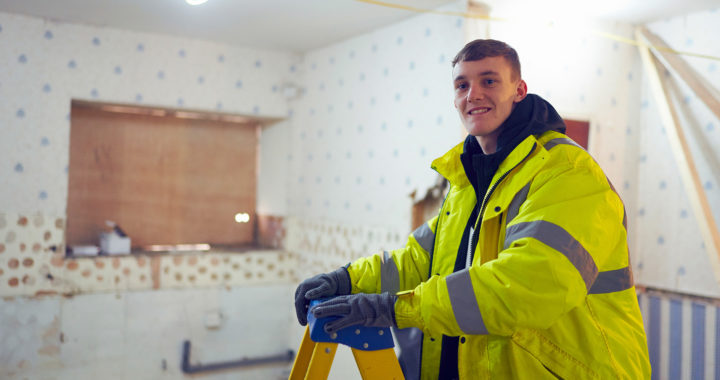 A construction student on an apprenticeship smiling at the camera