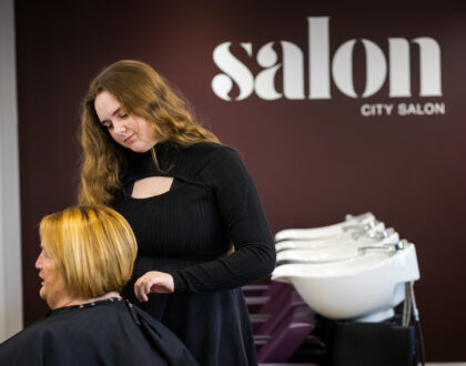 A Student at Sunderland College City Campus, styling the hair of someone