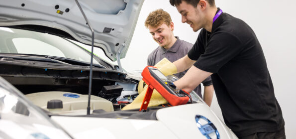 Students at City Campus working on Nissan cars. Nissan are a partner of the college.