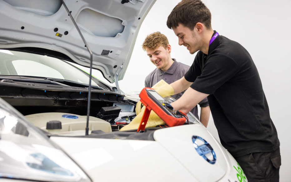 Students at City Campus working on Nissan cars. Nissan are a partner of the college.