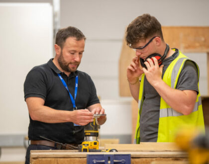 A Sunderland College Construction student in wokrshop with teacher.
