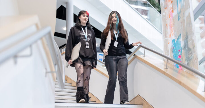 Students walking down stairs